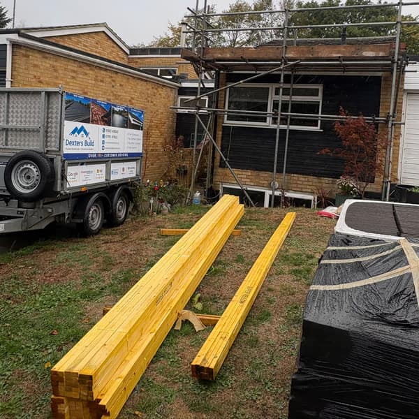 Scaffolding up at the bungalow, with new battens and tiles delivered and the Dexters Build trailer on the drive