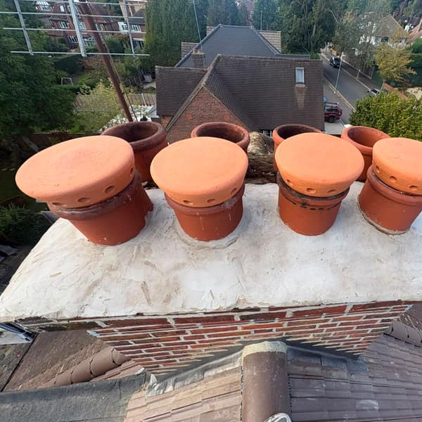 Chimney pots and cowls on the chimney stack, Watford re-roof