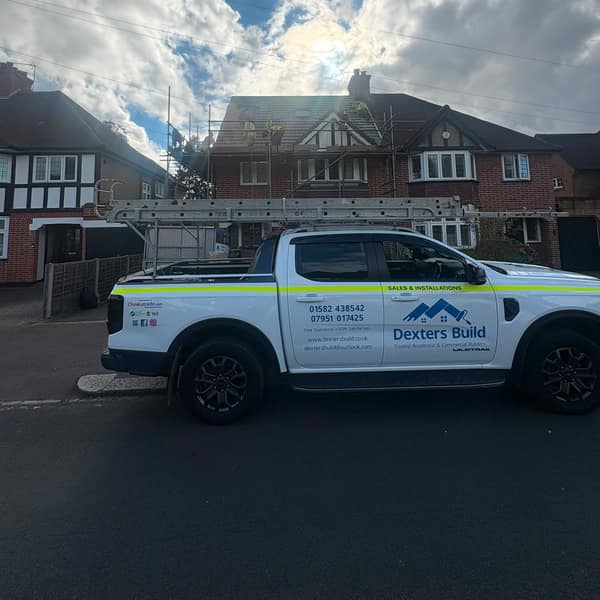 Dexters Build pickup outside the finished house in Watford