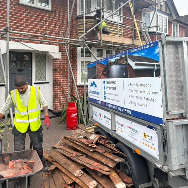 Clearing the old roof tiles and battens into the Dexters Build trailer